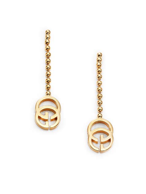 gucci running g earrings.